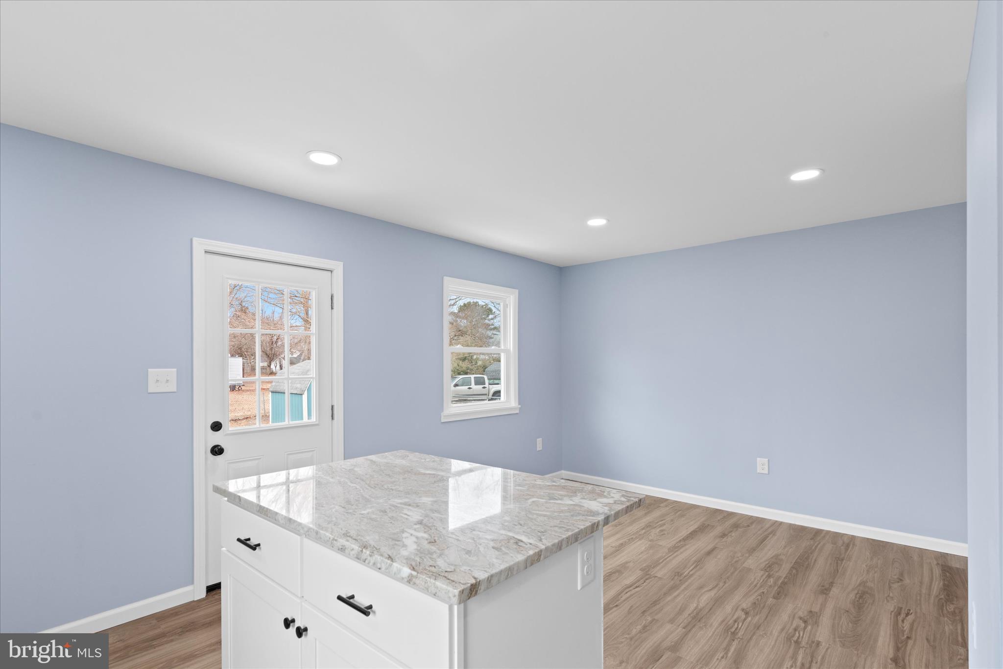 908 Spring Avenue Salisbury, MD 21804 - Photo 21 of 39 a view of kitchen island with wooden floor
