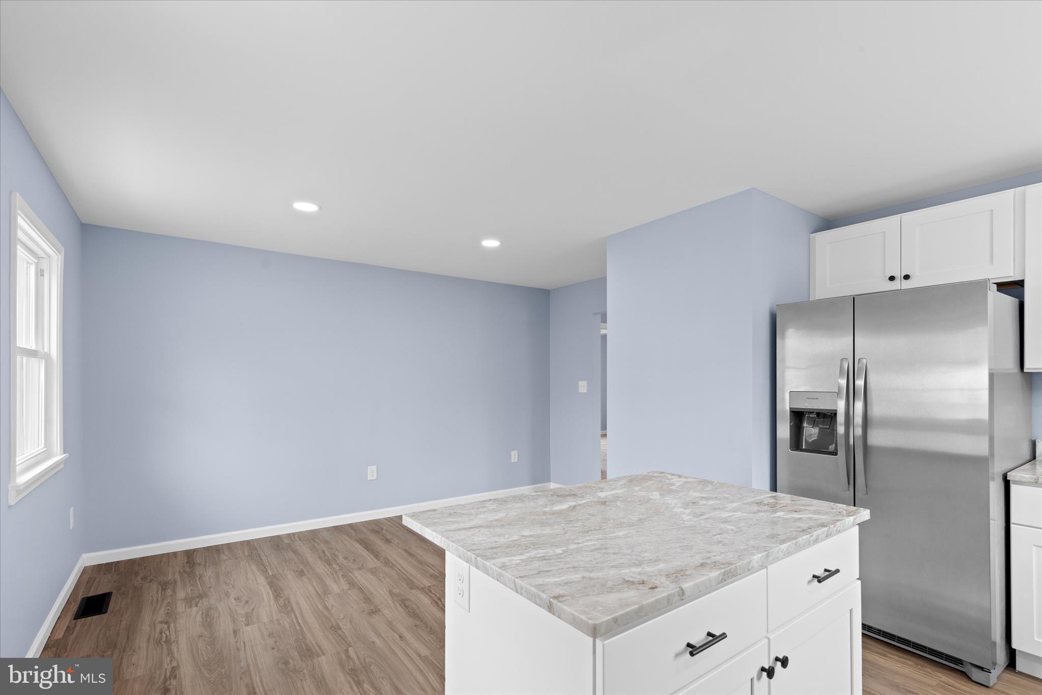 908 Spring Avenue Salisbury, MD 21804 - Photo 22 of 39 a kitchen with a refrigerator and a sink