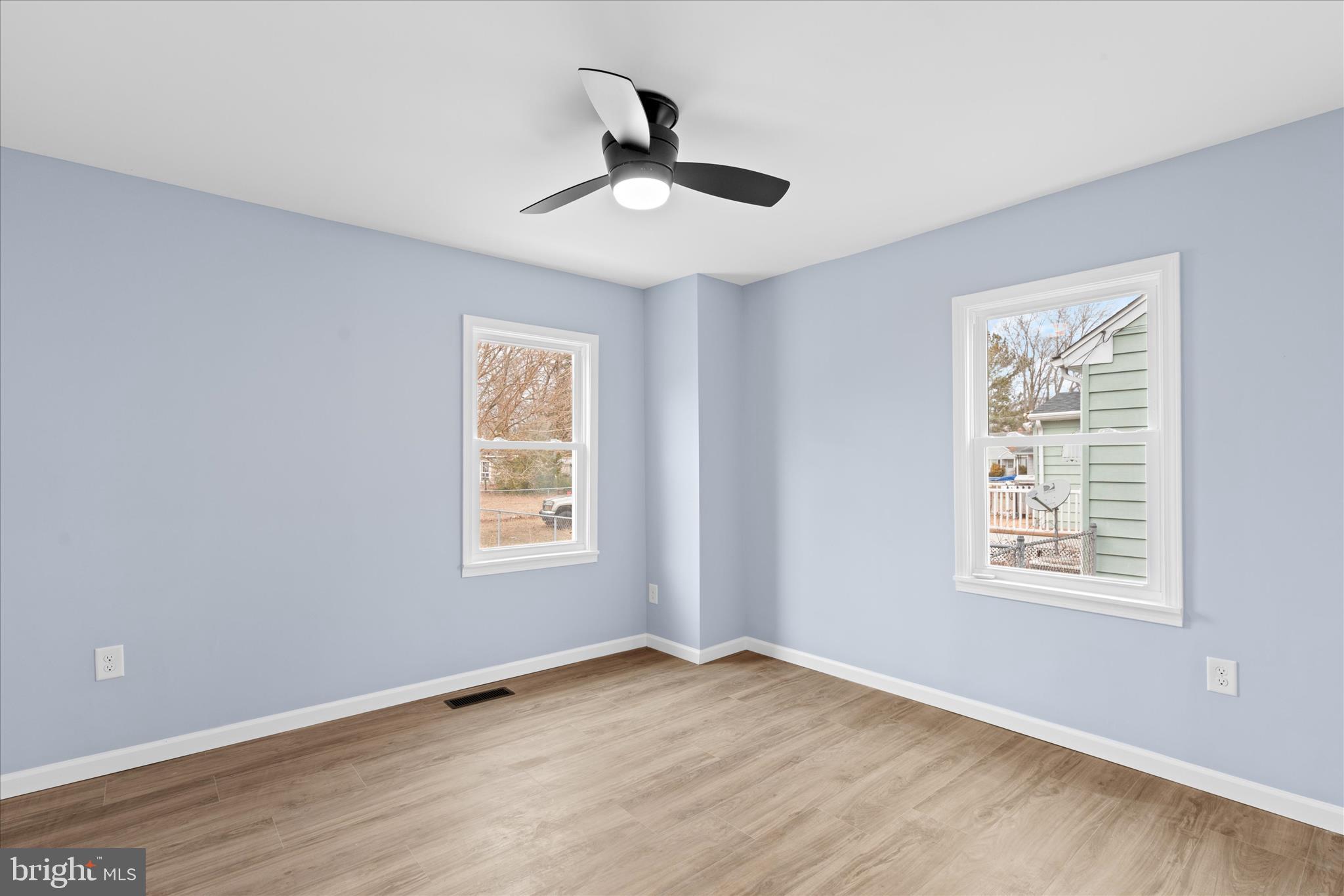 908 Spring Avenue Salisbury, MD 21804 - Photo 23 of 39 a view of an empty room with wooden floor and a window