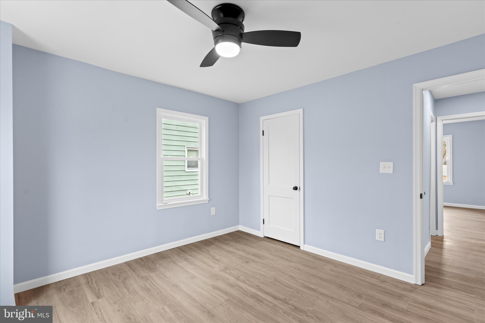 908 Spring Avenue Salisbury, MD 21804 - Photo 24 of 39 a view of an empty room with wooden floor and a window