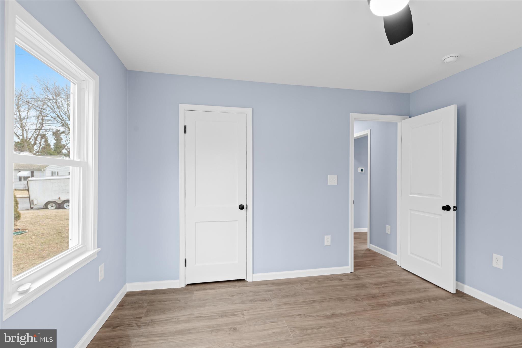 908 Spring Avenue Salisbury, MD 21804 - Photo 25 of 39 a view of an empty room with window and wooden floor