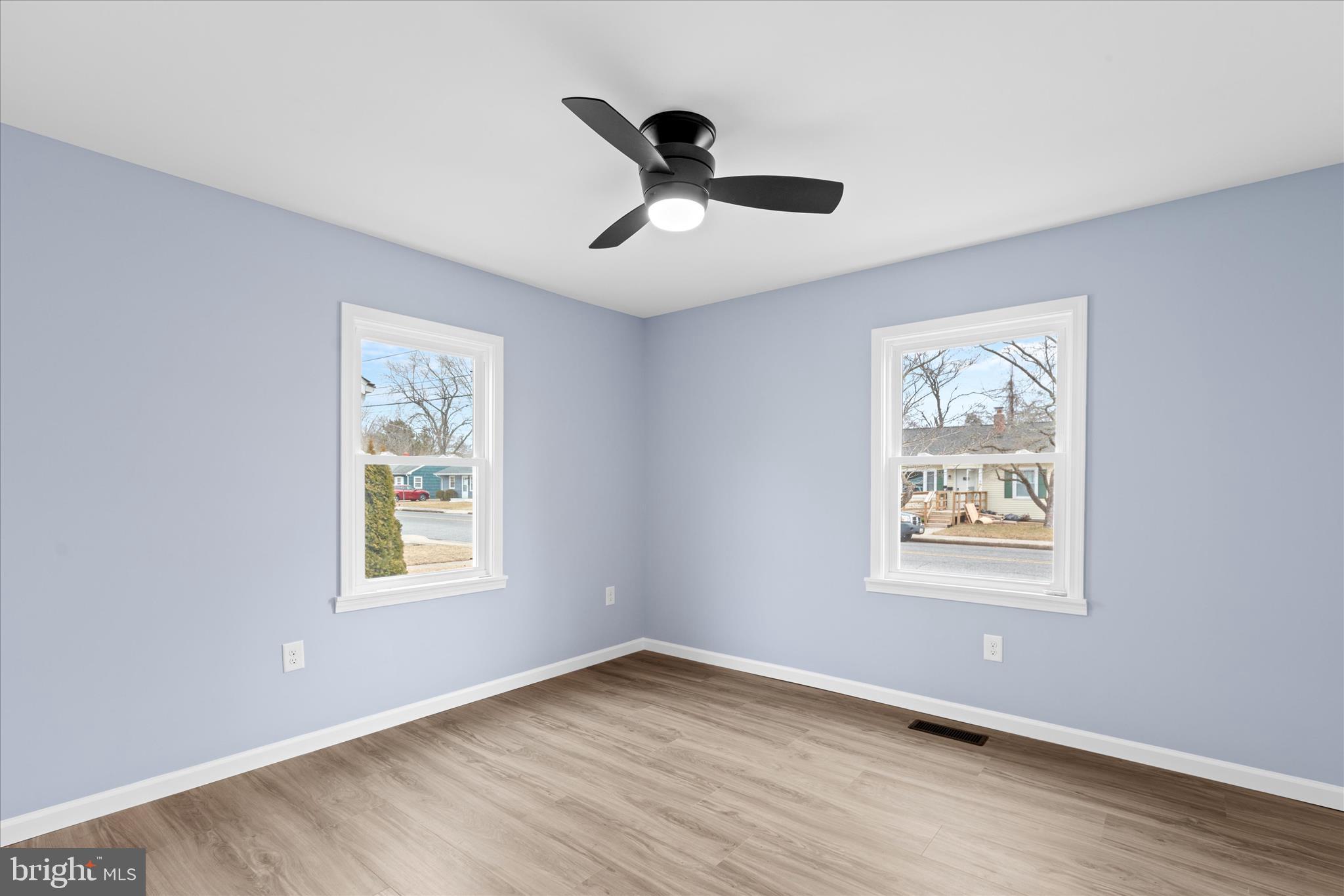 908 Spring Avenue Salisbury, MD 21804 - Photo 26 of 39 a view of an empty room with wooden floor and a window