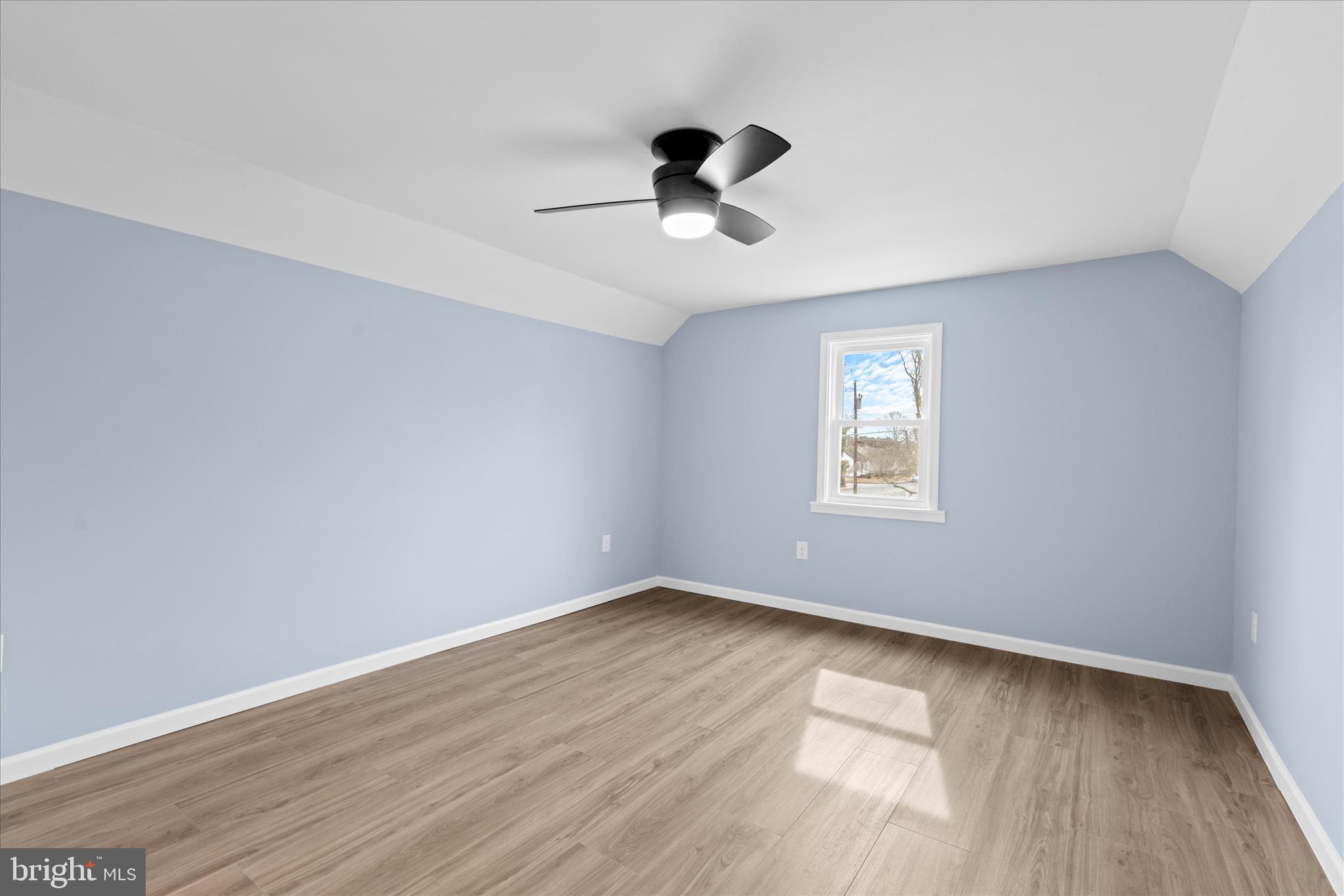 908 Spring Avenue Salisbury, MD 21804 - Photo 31 of 39 a view of an empty room with wooden floor and a window