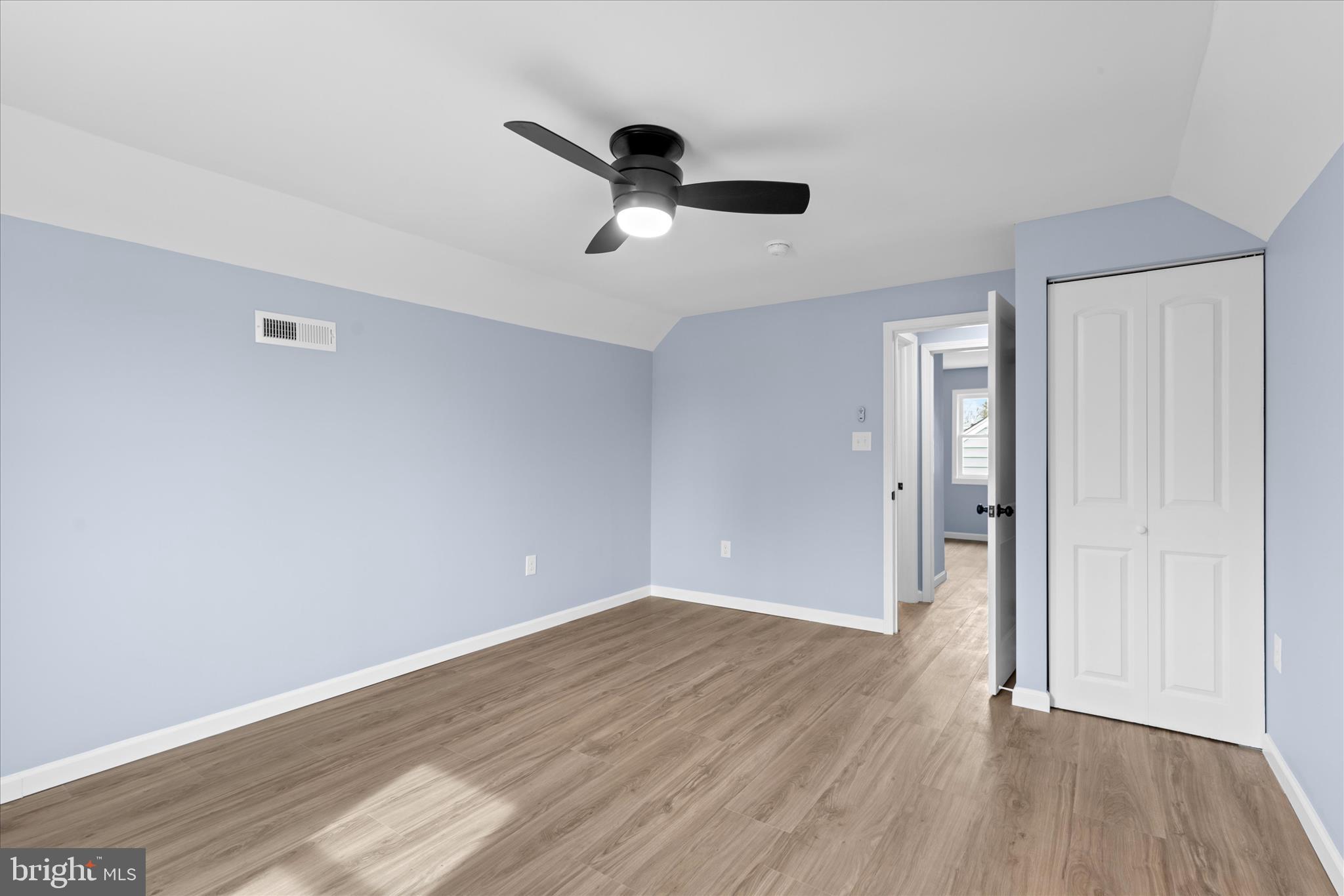 908 Spring Avenue Salisbury, MD 21804 - Photo 33 of 39 an empty room with wooden floor and windows