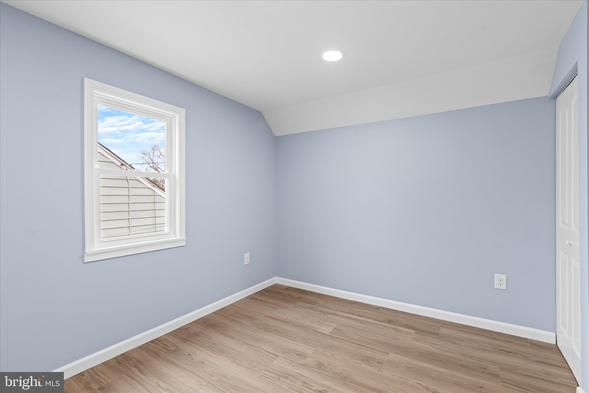 908 Spring Avenue Salisbury, MD 21804 - Photo 34 of 39 an empty room with wooden floor and windows