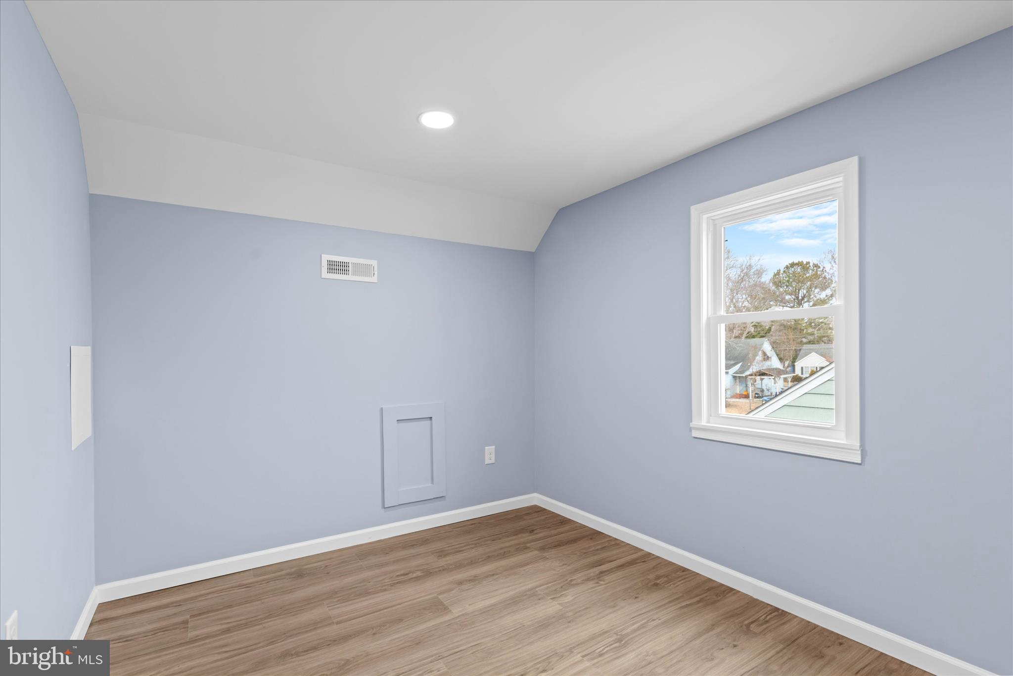 908 Spring Avenue Salisbury, MD 21804 - Photo 36 of 39 an empty room with wooden floor and window