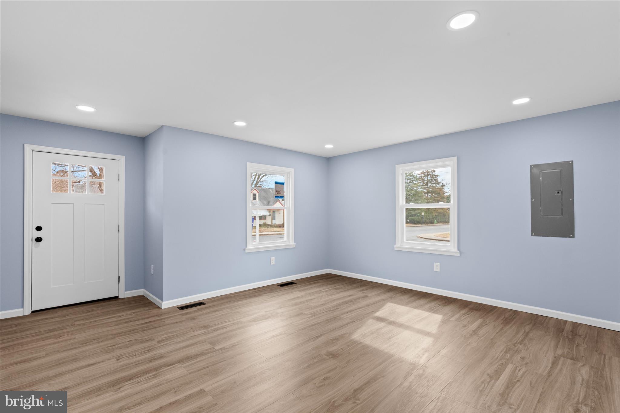 908 Spring Avenue Salisbury, MD 21804 - Photo 4 of 39 a view of an empty room with wooden floor and a window