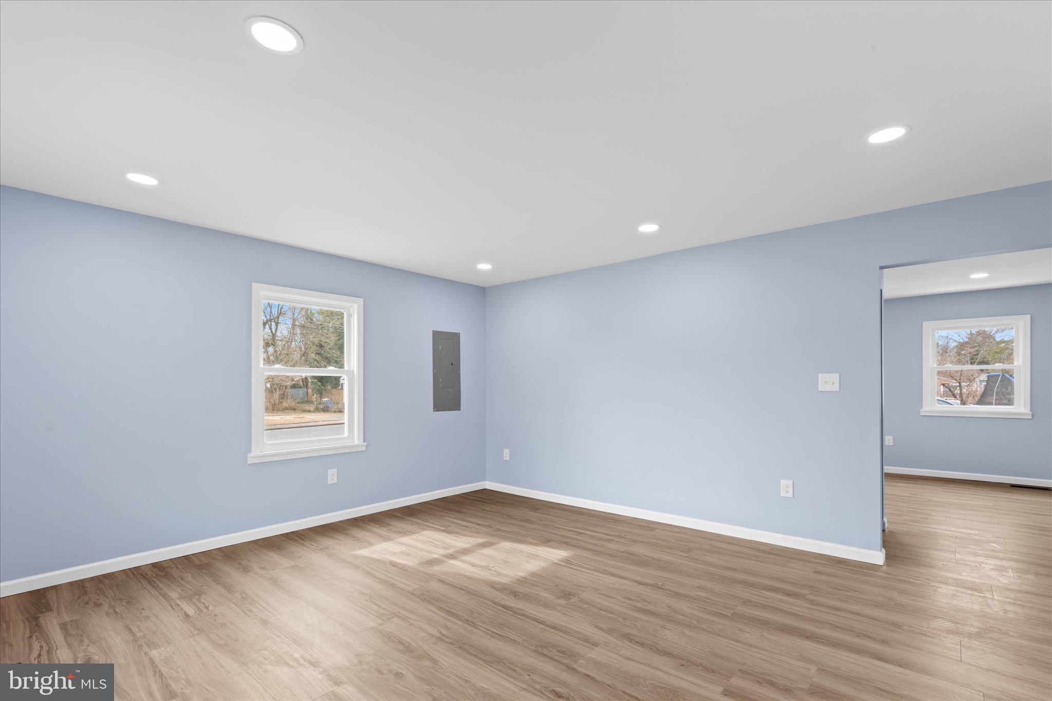 908 Spring Avenue Salisbury, MD 21804 - Photo 5 of 39 an empty room with wooden floor and windows