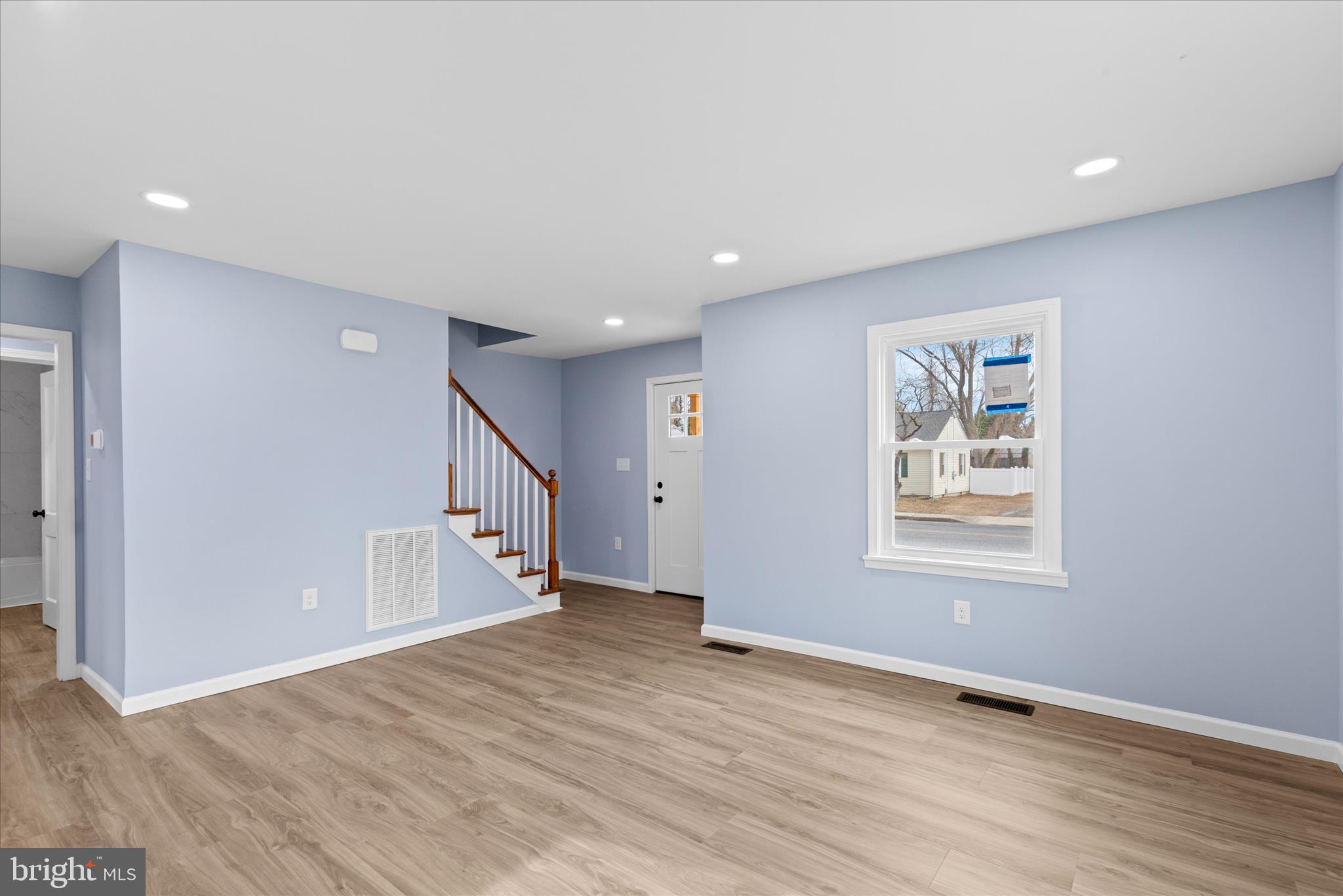 908 Spring Avenue Salisbury, MD 21804 - Photo 7 of 39 a view of an empty room with wooden floor and a window