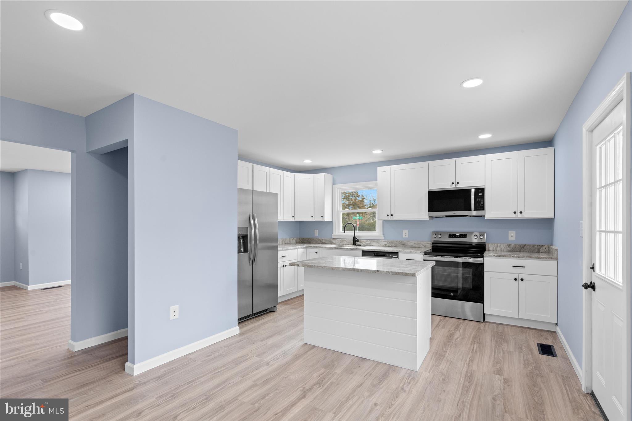 908 Spring Avenue Salisbury, MD 21804 - Photo 8 of 39 a kitchen with cabinets and stainless steel appliances
