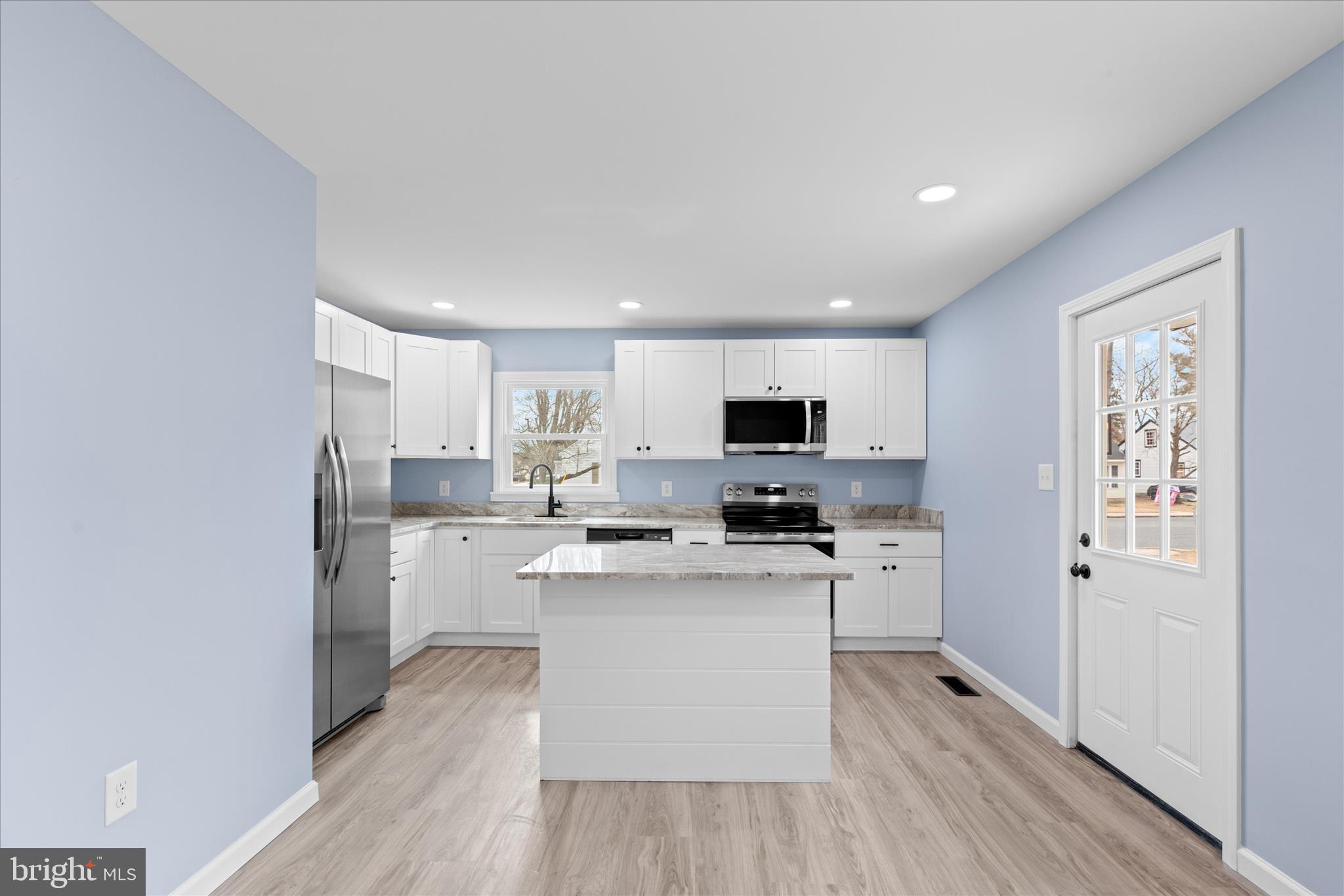908 Spring Avenue Salisbury, MD 21804 - Photo 9 of 39 a kitchen with cabinets a sink and appliances