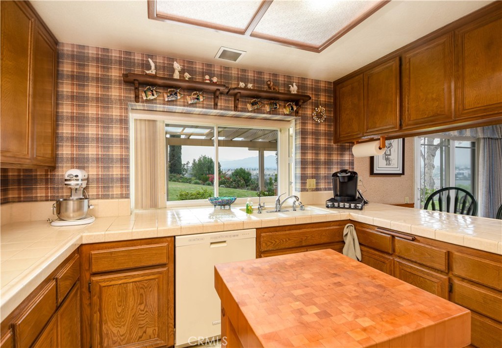 871 Kevin Corona, CA 92878 - Photo 13 of 34 a kitchen with a sink and cabinets