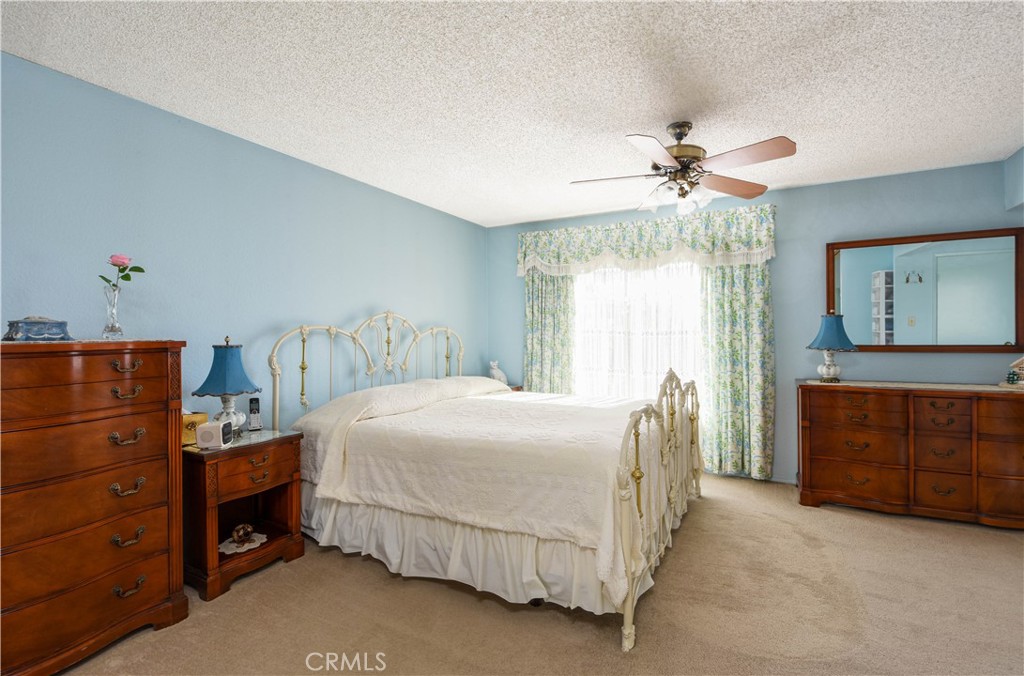 871 Kevin Corona, CA 92878 - Photo 16 of 34 a bedroom with a bed and a dresser
