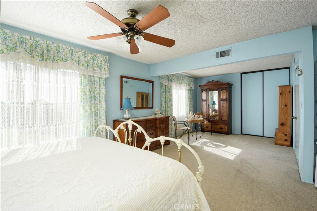 871 Kevin Corona, CA 92878 - Photo 17 of 34 a bedroom with a bed and a large window