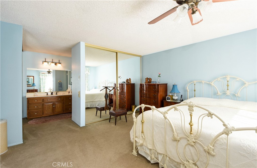 871 Kevin Corona, CA 92878 - Photo 18 of 34 a bedroom with a bed a table and chairs