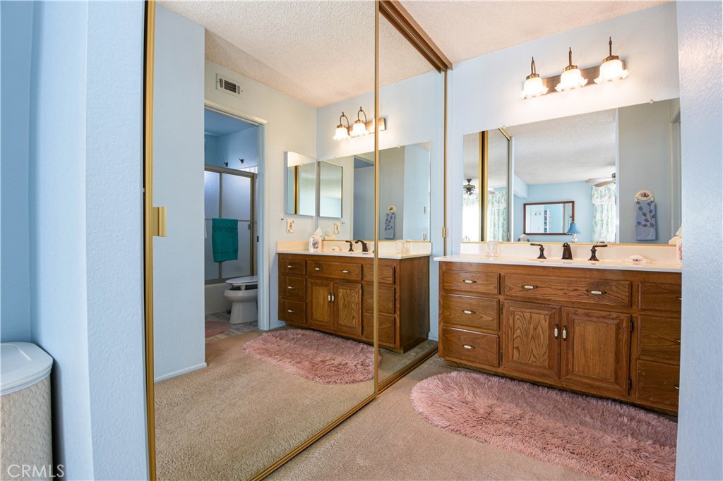 871 Kevin Corona, CA 92878 - Photo 19 of 34 a spacious bathroom with a double vanity sink and a mirror