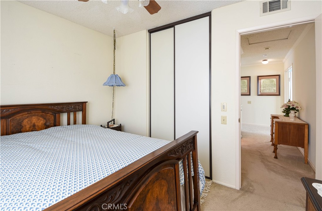 871 Kevin Corona, CA 92878 - Photo 21 of 34 a bedroom with a bed and a table in it