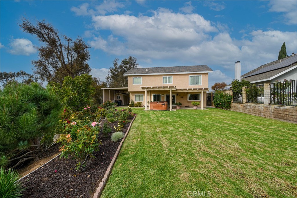 871 Kevin Corona, CA 92878 - Photo 30 of 34 a view of a house with backyard and garden