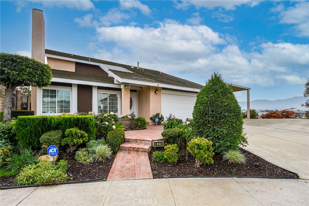 871 Kevin Corona, CA 92878 - Photo 33 of 34 a front view of a house with garden
