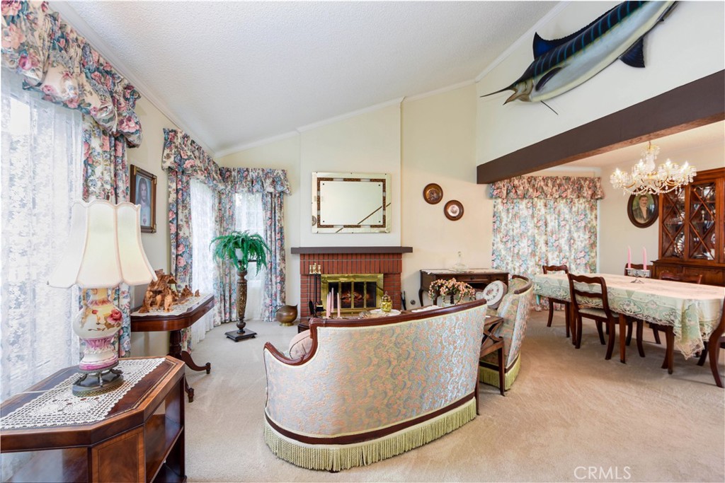 871 Kevin Corona, CA 92878 - Photo 4 of 34 a living room with fireplace furniture and a large window