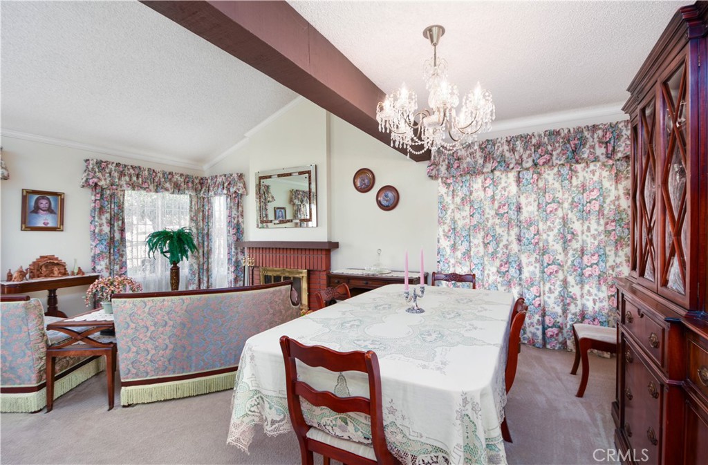 871 Kevin Corona, CA 92878 - Photo 6 of 34 a living room with furniture and a chandelier