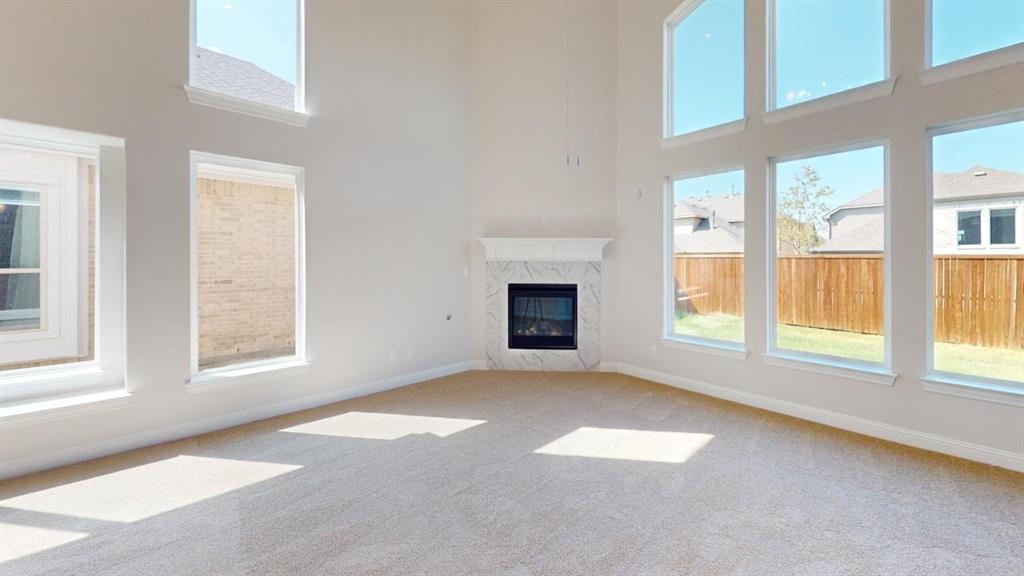 8407 Cornerstone Drive Rowlett, TX 75088 - Photo 20 of 25 Expansive living area with soaring ceilings and abundant natural light