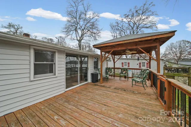 an aerial view of a house with a lake view