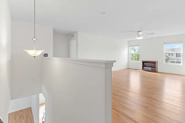 a view of livingroom with hardwood floor and a ceiling fan