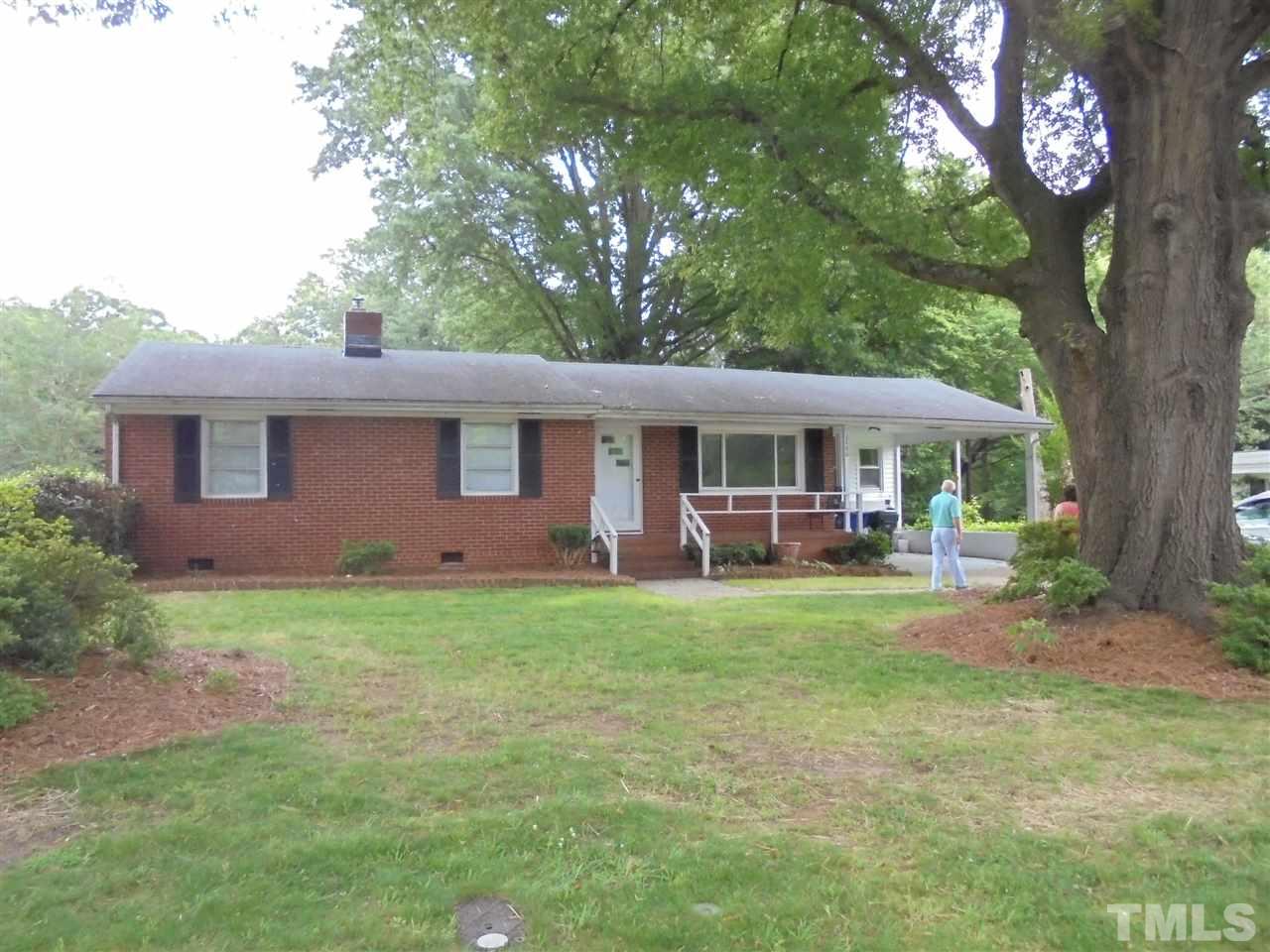 3520 Baugh Street Raleigh, NC 27604 - Photo 1 of 17 a front view of a house with garden
