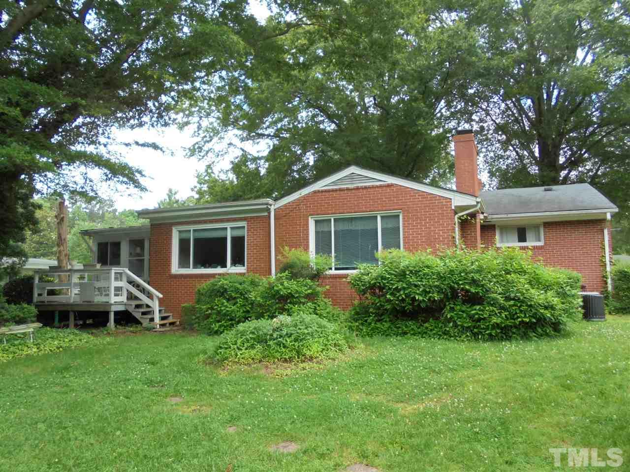 3520 Baugh Street Raleigh, NC 27604 - Photo 3 of 17 a front view of a house with a garden