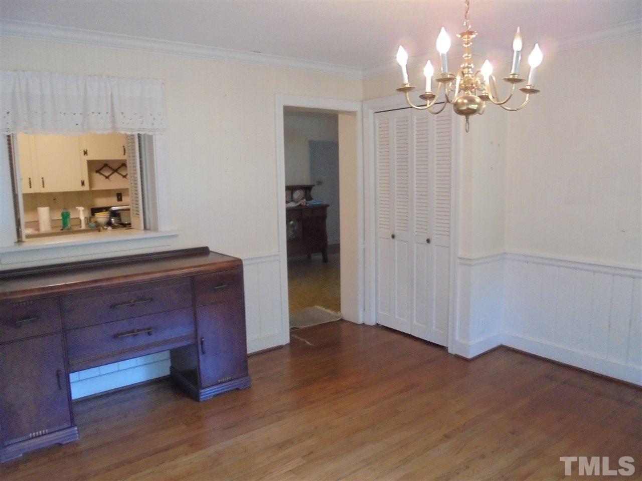 3520 Baugh Street Raleigh, NC 27604 - Photo 8 of 17 a view of a room with wooden floor and cabinet