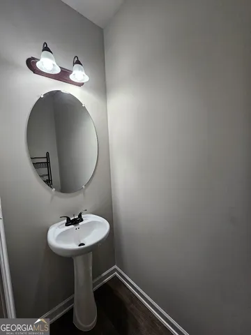 a bathroom with a sink and mirror