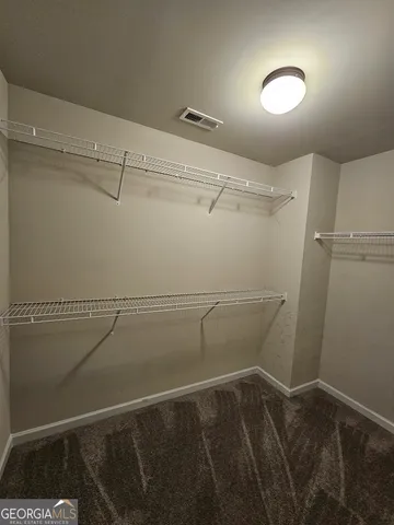 a view of a room with racks on the wall