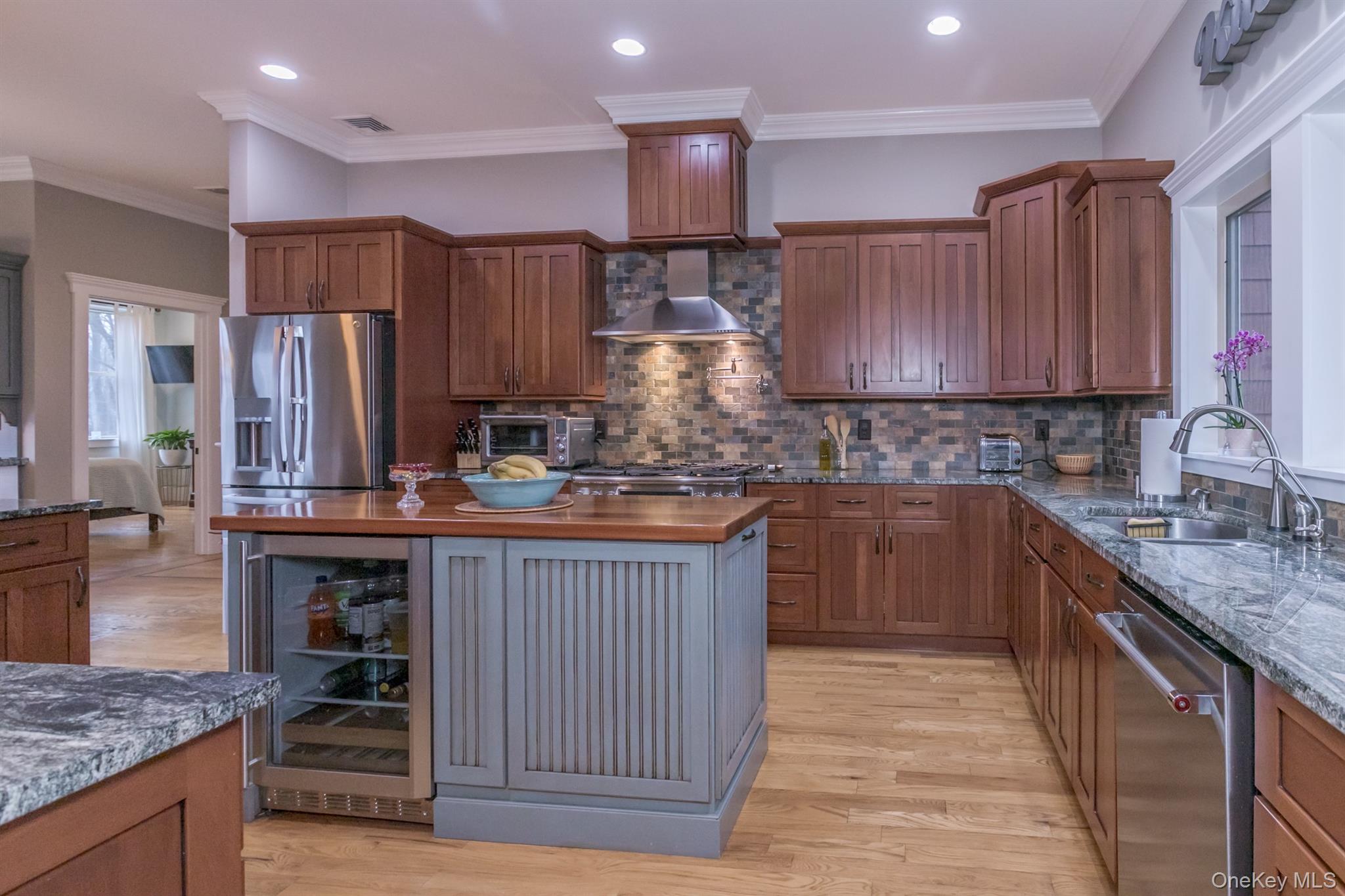 1 Peck Ridge Road Warwick, NY 10990 - Photo 11 of 50 a kitchen with kitchen island granite countertop wooden cabinets a sink and dishwasher