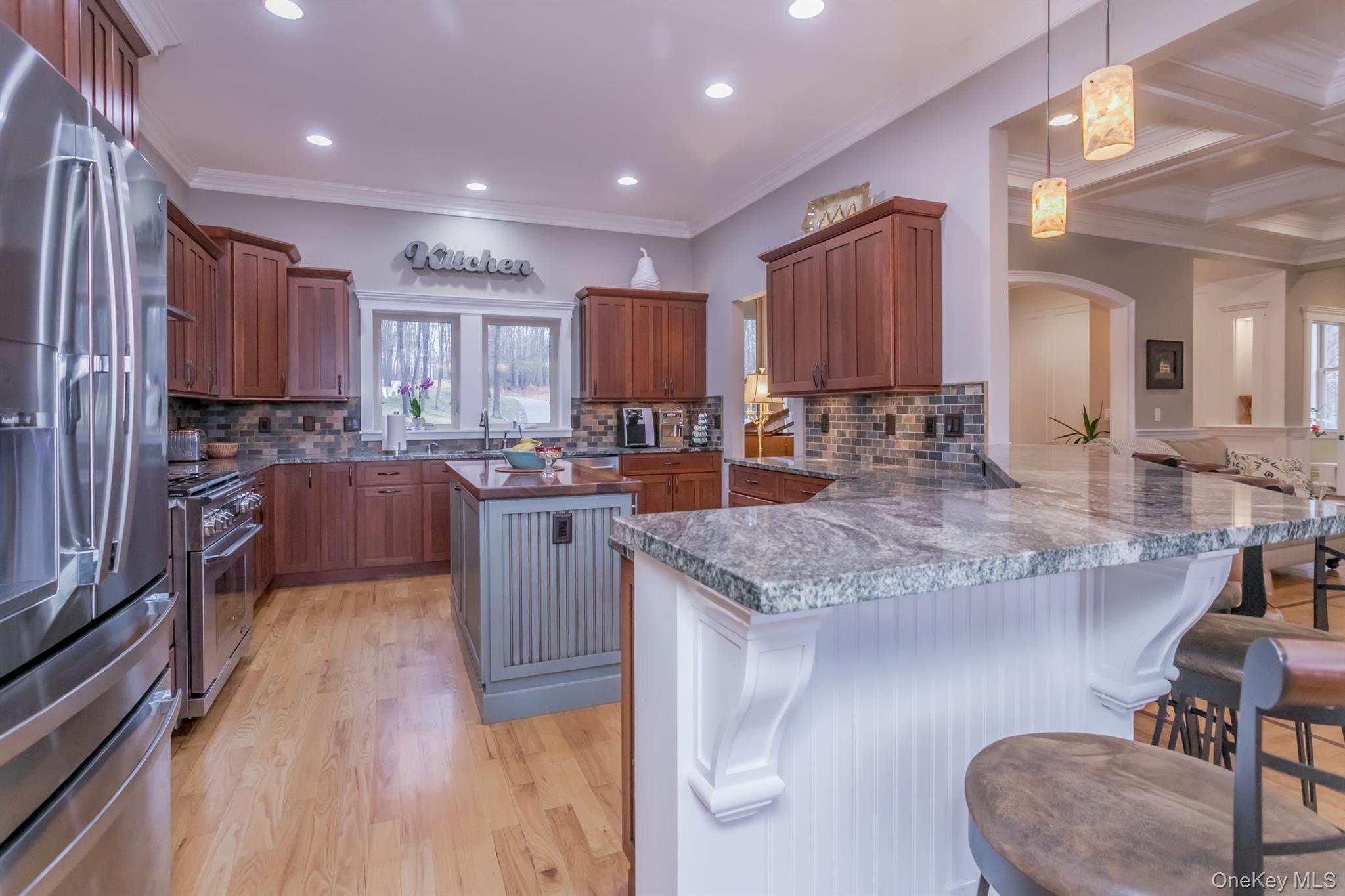1 Peck Ridge Road Warwick, NY 10990 - Photo 12 of 50 a kitchen with stainless steel appliances granite countertop wooden cabinets a sink and a stove