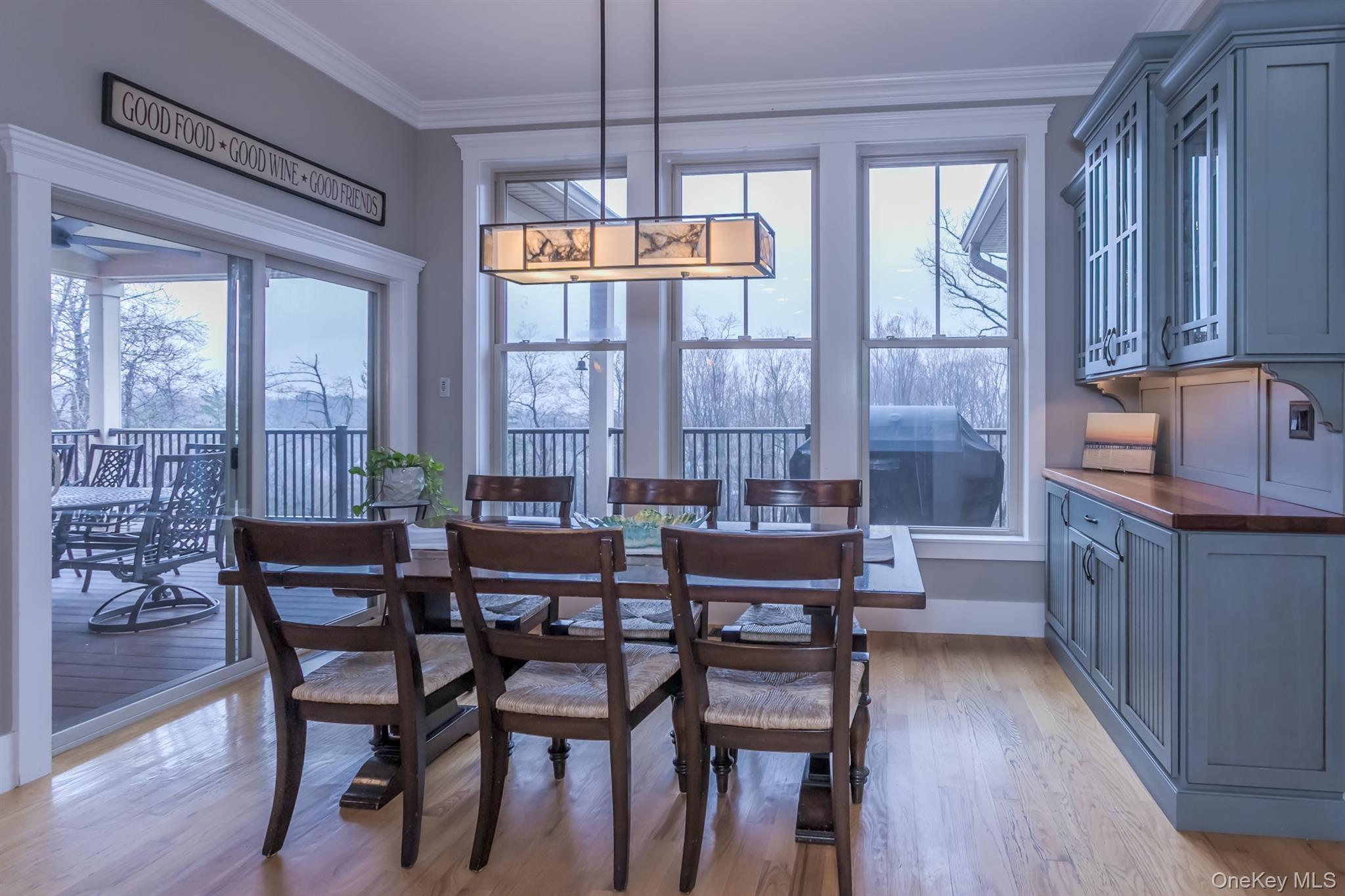 1 Peck Ridge Road Warwick, NY 10990 - Photo 13 of 50 a dining room with furniture a chandelier and wooden floor
