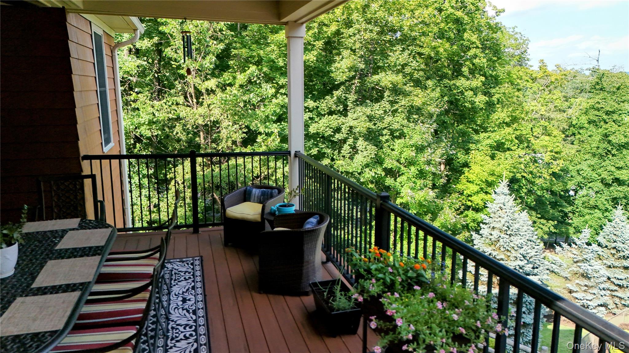 1 Peck Ridge Road Warwick, NY 10990 - Photo 14 of 50 a view of a balcony with wooden floor and outdoor seating