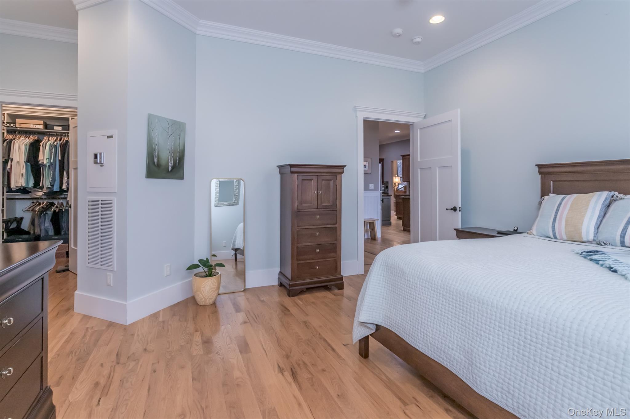 1 Peck Ridge Road Warwick, NY 10990 - Photo 16 of 50 a spacious bedroom with a bed and wooden floor