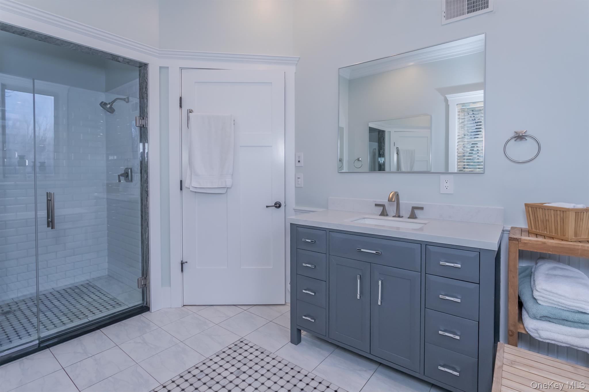 1 Peck Ridge Road Warwick, NY 10990 - Photo 18 of 50 a bathroom with a shower a sink and a mirror