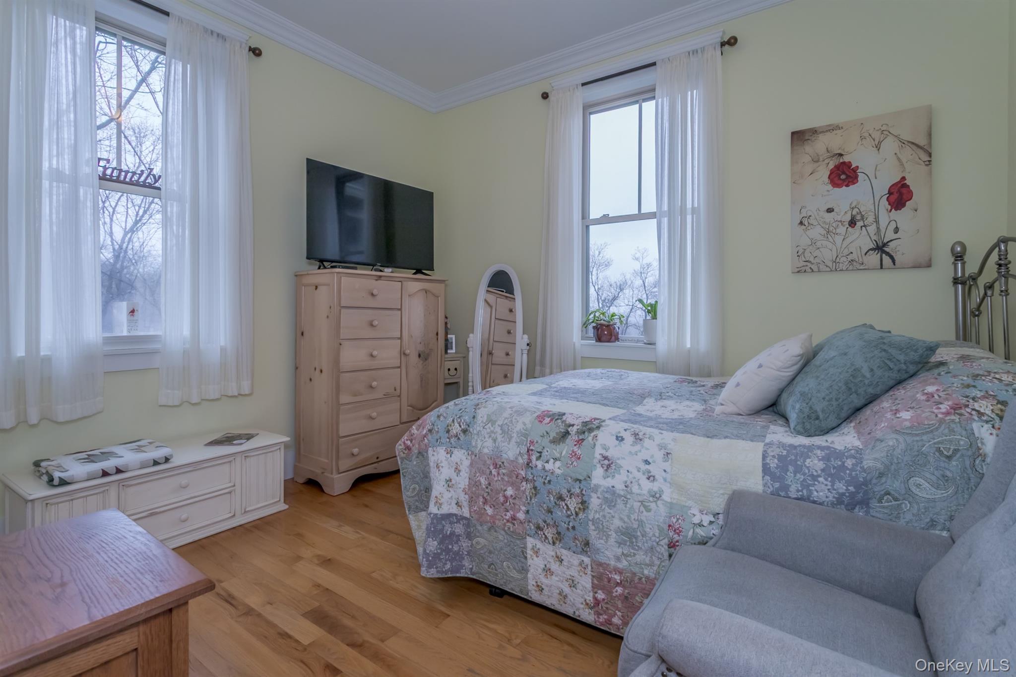 1 Peck Ridge Road Warwick, NY 10990 - Photo 20 of 50 a bedroom with a bed and a flat screen tv