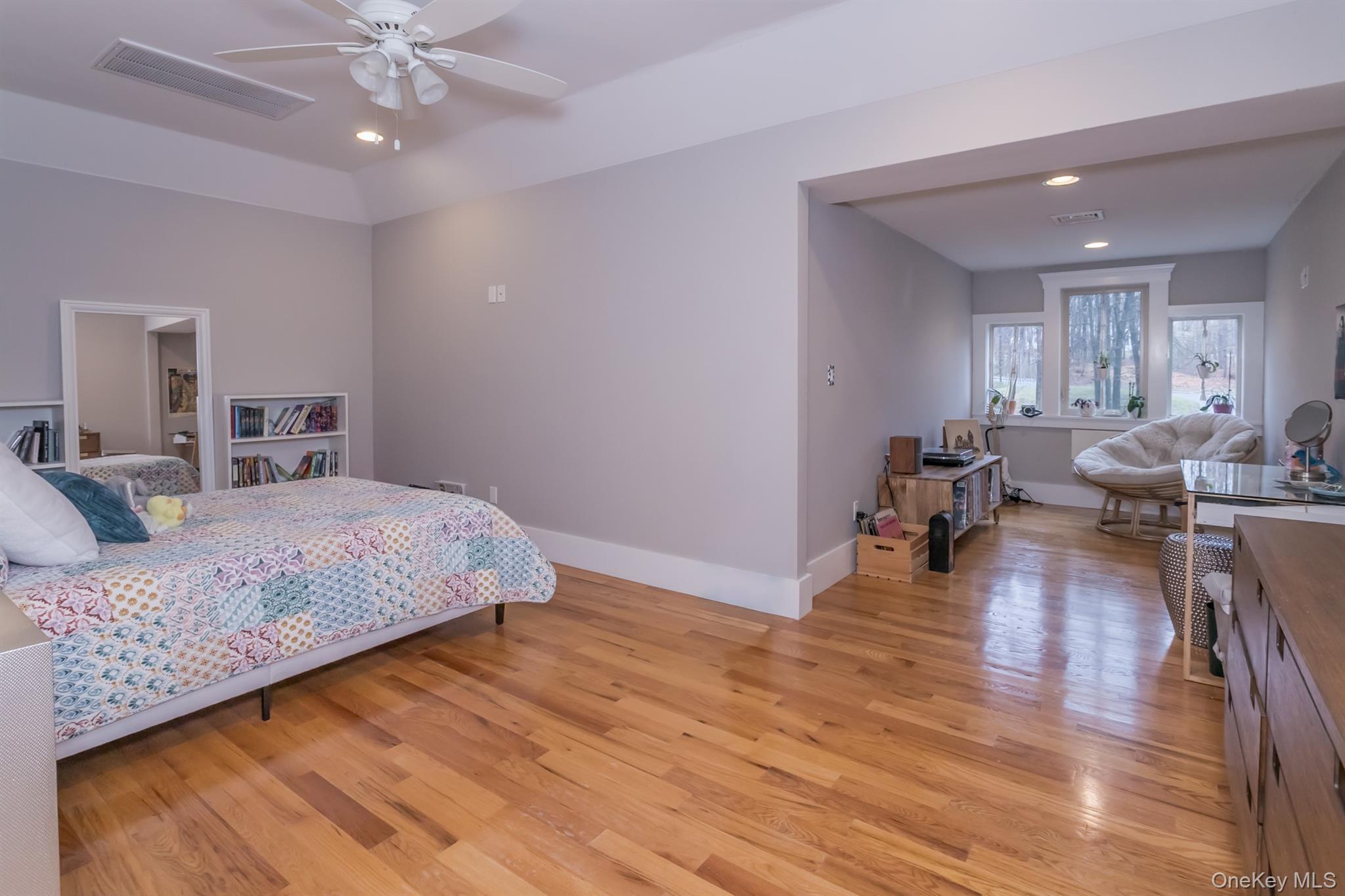 1 Peck Ridge Road Warwick, NY 10990 - Photo 29 of 50 a spacious bedroom with a bed and wooden floor