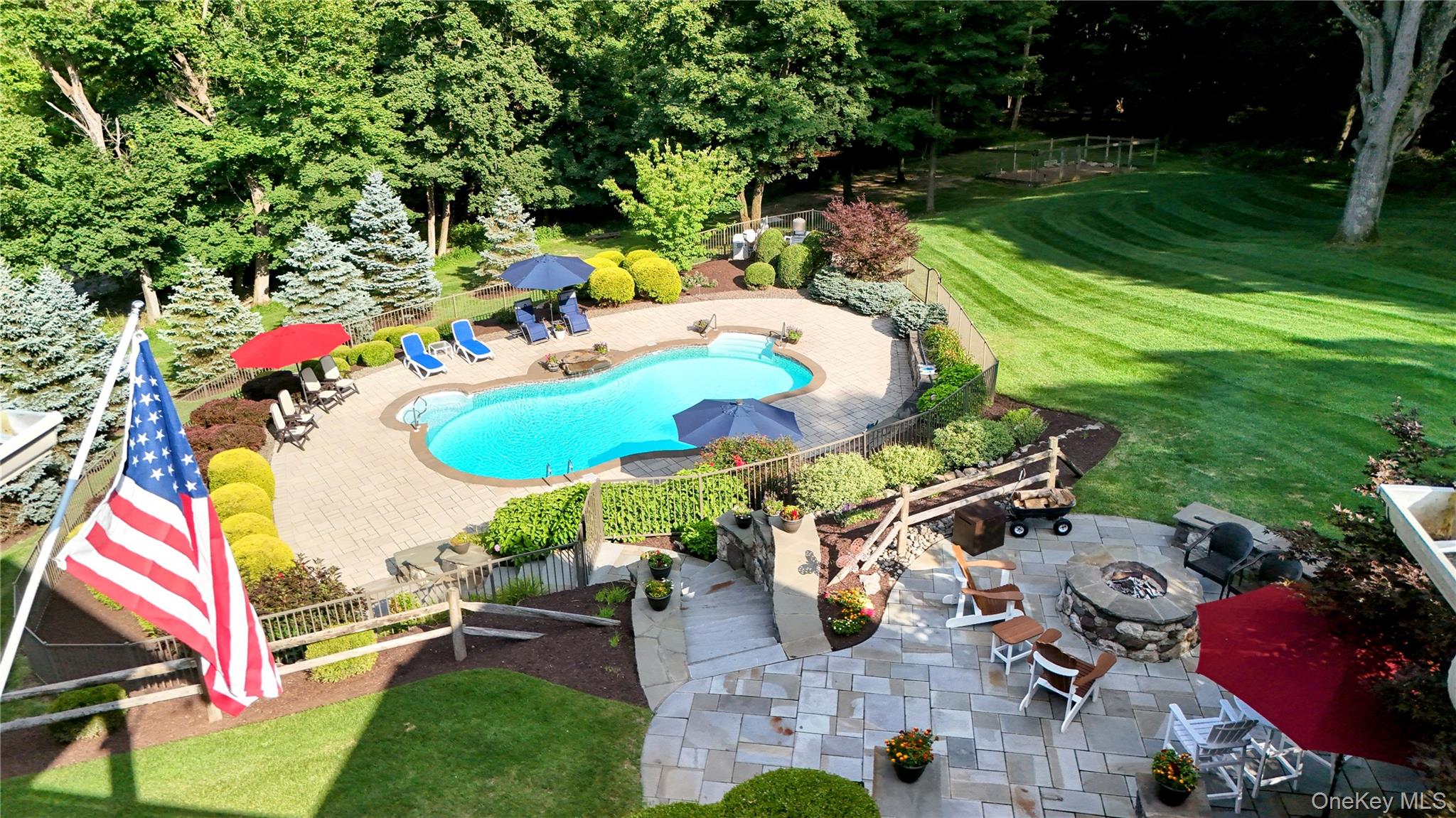 1 Peck Ridge Road Warwick, NY 10990 - Photo 43 of 50 an aerial view of a swimming pool patio and outdoor seating