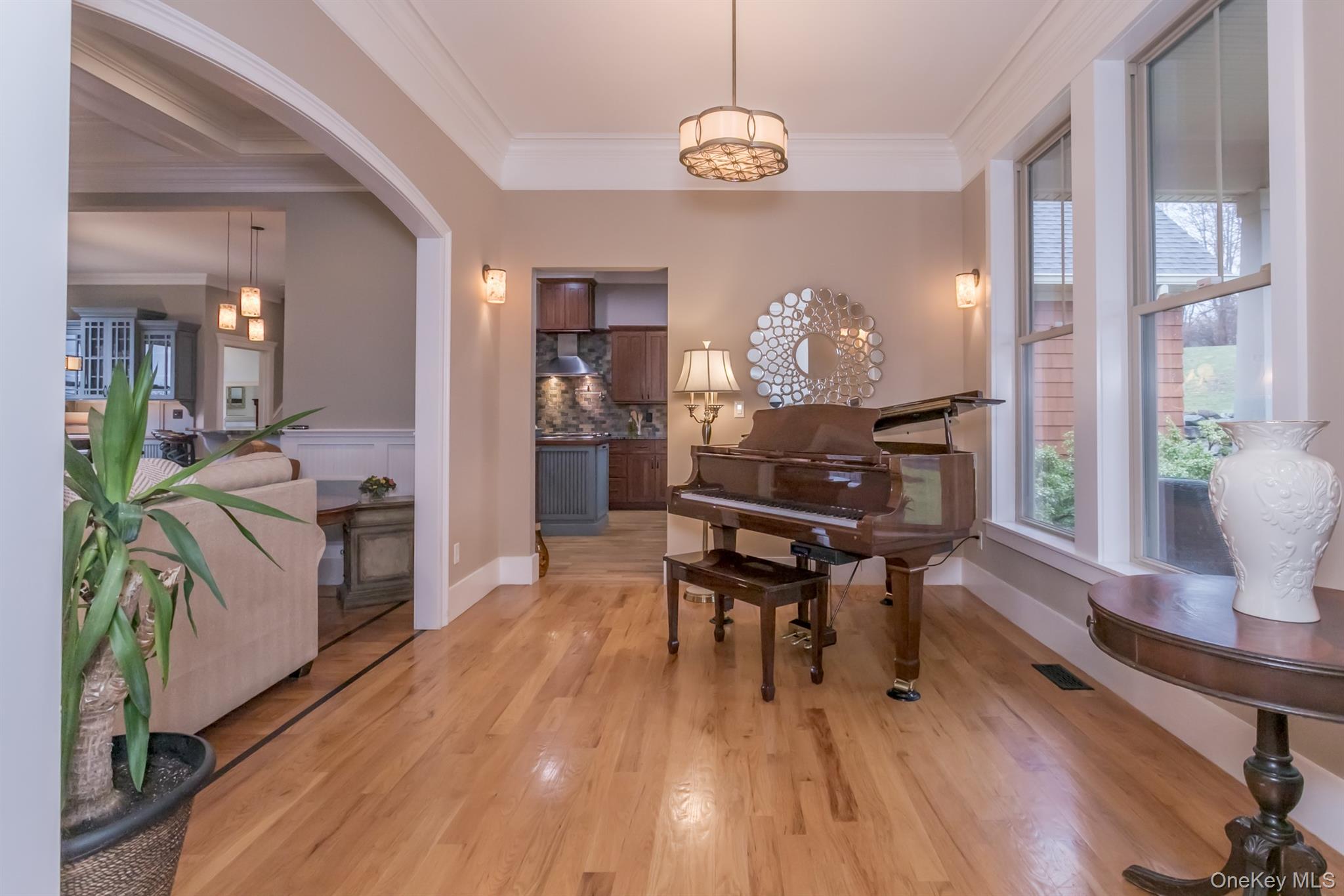 1 Peck Ridge Road Warwick, NY 10990 - Photo 7 of 50 a dining room with wooden floor a chandelier a wooden table and chairs