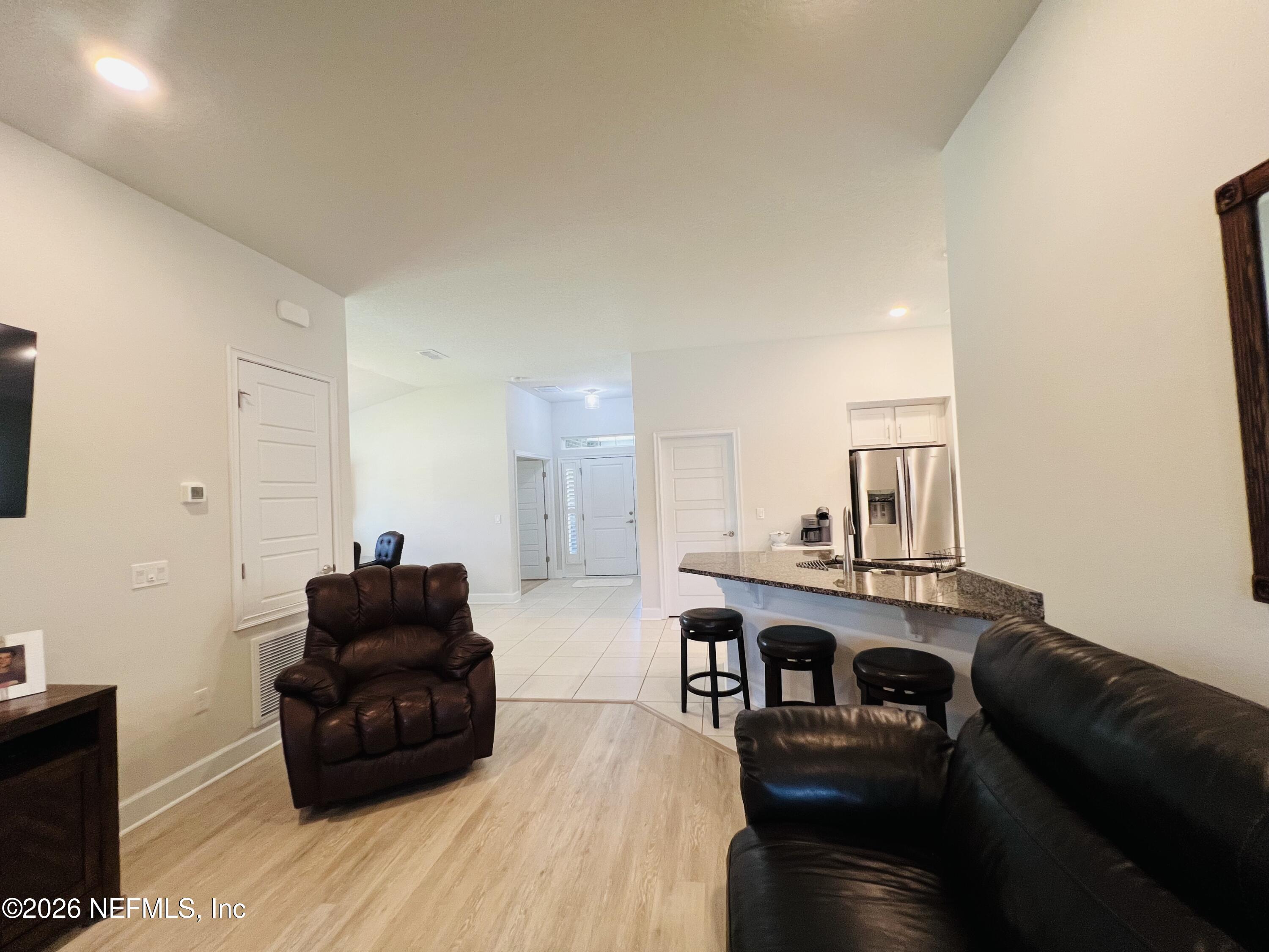 2 Rivertown Road Palm Coast, FL 32137 - Photo 55 of 80 a living room with furniture and a couch