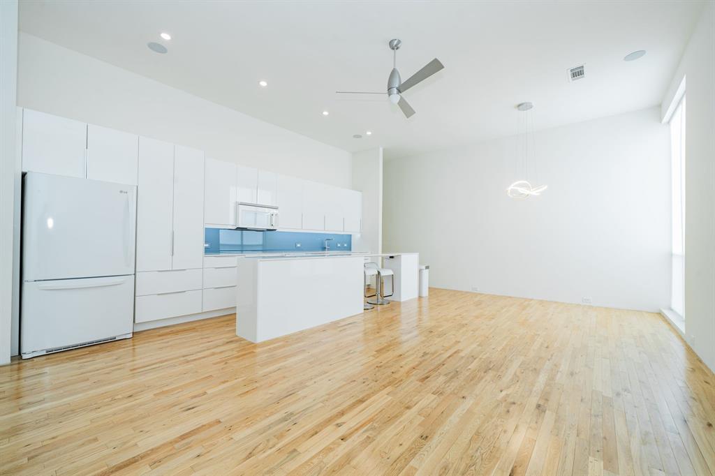 2325 Rusk Place Dallas, TX 75204 - Photo 11 of 27 a view of a kitchen with a sink and wooden floor