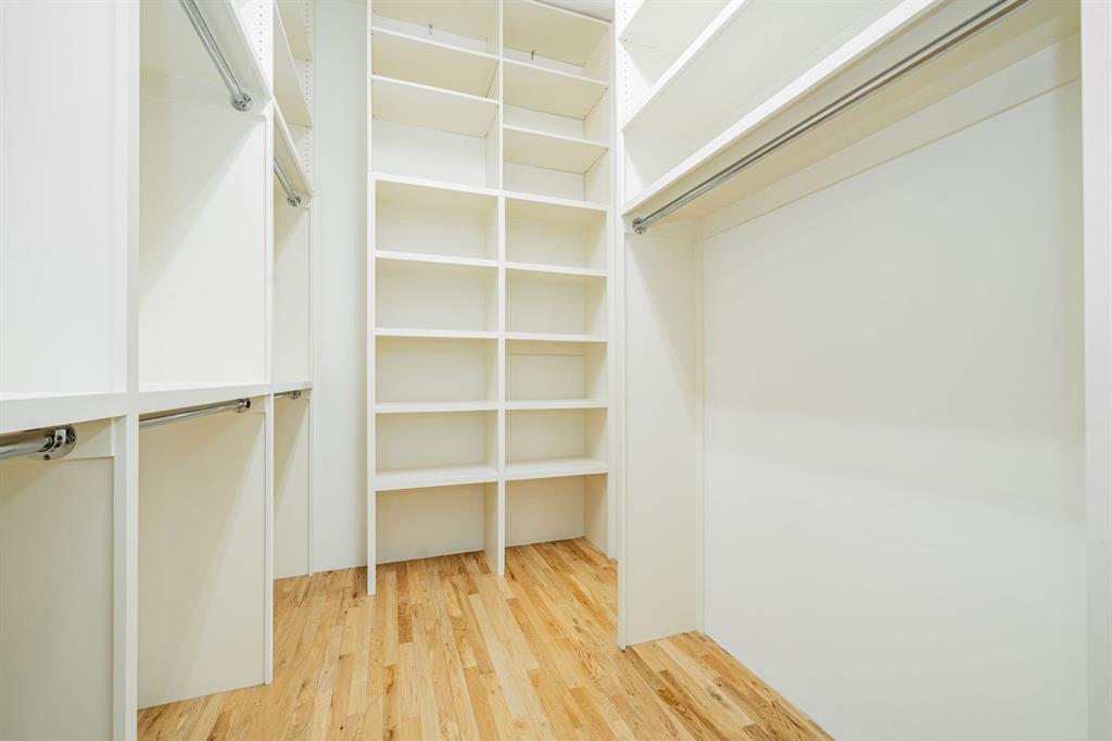 2325 Rusk Place Dallas, TX 75204 - Photo 19 of 27 a view of walk in closet with empty racks