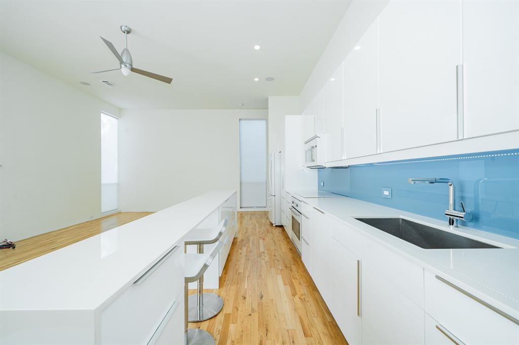 2325 Rusk Place Dallas, TX 75204 - Photo 5 of 27 a view of a kitchen with a sink and dishwasher