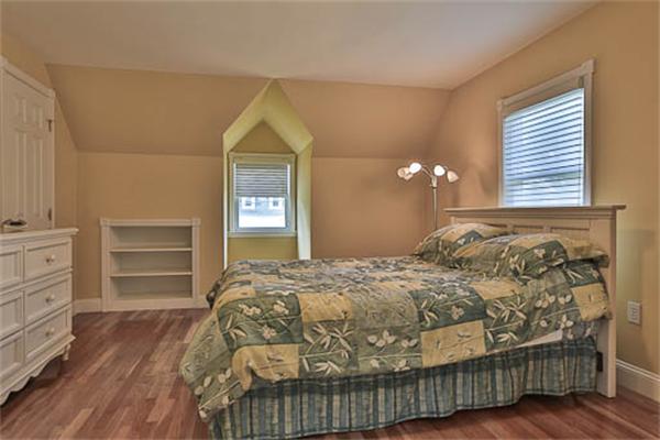 2648 Massachusetts Avenue Lexington, MA 02421 - Photo 12 of 19 a bedroom with a bed and cabinets