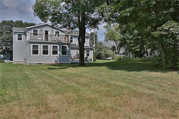 2648 Massachusetts Avenue Lexington, MA 02421 - Photo 18 of 19 a front view of a house with a garden