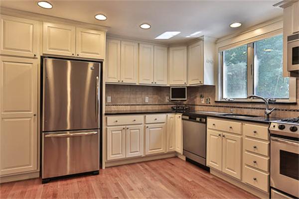 2648 Massachusetts Avenue Lexington, MA 02421 - Photo 5 of 19 a kitchen with granite countertop stainless steel appliances a refrigerator sink and cabinets
